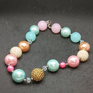 Gold, Blue And Pink Necklace with Textured Focal Bead
